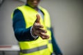 Helping hand. Businessman extending hand for handshake, close-up Royalty Free Stock Photo