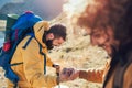 Hiker man getting help on hike happy overcoming obstacle