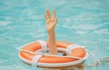 Helping hand. Life problems. Drowning person. Rescue swimming ring in water. Safety water equipment. Royalty Free Stock Photo