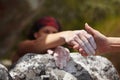 A helping hand. One rock climber giving a helping hand to another. Royalty Free Stock Photo