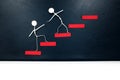 Helping hand, support and teamwork concept. Two human stick figures climbing a red ladder. Royalty Free Stock Photo