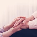 Helping hands, care for the elderly concept. Close-up handshake Royalty Free Stock Photo