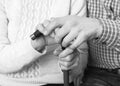 Helping hands, care for elderly concept. Close-up handshake. Black and white photo Royalty Free Stock Photo