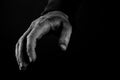 Helping hands concept, Man`s hands reaching out, asking for help, close up, black and white Royalty Free Stock Photo