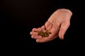 Helping hands concept, Rich giving the poor, Man`s hands palms up holding money coins, reaching out, showing compassion