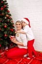 Helping mum with the tree. Christmas joy with family Royalty Free Stock Photo