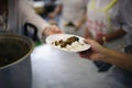 Helping the poor to enjoy eating delicious food Royalty Free Stock Photo