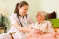 Helping a sick elderly woman Royalty Free Stock Photo
