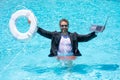 Helping summer business. Businessman in suit hold laptop and lifebuoy in sea beach water. Rescue businessman. Helping