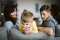 Helpless parents and their badly behaving son at home Royalty Free Stock Photo