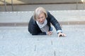 Helpless senior woman falling down steps Royalty Free Stock Photo