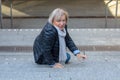 Helpless senior woman falling down steps Royalty Free Stock Photo