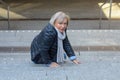 Helpless senior woman falling down steps Royalty Free Stock Photo