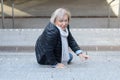 Helpless senior woman falling down steps Royalty Free Stock Photo