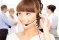 Helpline operator with headphones in call centre Royalty Free Stock Photo