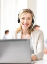 Helpline operator with headphones in call centre Royalty Free Stock Photo