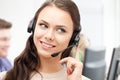 Helpline operator with headphones in call centre Royalty Free Stock Photo