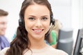 Helpline operator with headphones in call centre Royalty Free Stock Photo