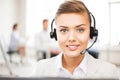 Helpline operator with headphones in call centre Royalty Free Stock Photo