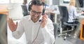 Helpline operator man with headphones in call centre. Royalty Free Stock Photo