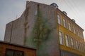 Helsingor, Denmark: Beautiful graffiti on the wall. Hamlet with Shakespeare`s skull. Street view with colorful buildings in Royalty Free Stock Photo