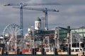 Helsinki, capital of Finland. The Lutheran cathedral, a Ferris wheel, construction cranes