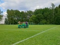 Helsinki Cup junior football tournament - young boys team taking a strategic moment before the match