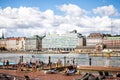 Helsinki, Finland - August 5, 2018: Allas Sea public pool and the main square and marina. People have a rest on a sunny