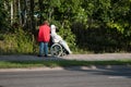 Autumn airing of old man in wheelchair