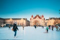 Helsinki, Finland. Children Skating On Rink On Railway Square On Background Of Finnish National Theatre In Winter Sunny