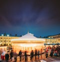 Helsinki, Finland. Christmas Xmas Holiday Carousel On Senate Square At Winter Evening. Colourful Night Starry Sky In