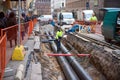 HELSINKI, FINLAND 18 DEC 2018: Human inspector checks how the work is done. Replacement pipes in the city