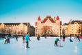 Helsinki, Finland. Children Skating On Rink On Railway Square On Background Of Finnish National Theatre In Winter Sunny