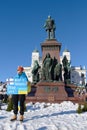 Demonstrator in a rally against RussiaÃ¢â¬â¢s military aggression and occupation of Ukraine carrying Help Ukraine - Stop War sign