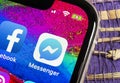 Facebook messenger application icon on Apple iPhone X screen close-up. Facebook messenger app icon. Online internet social media n Royalty Free Stock Photo