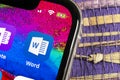 Microsoft Word application icon on Apple iPhone X screen close-up. Microsoft office word icon. Microsoft office on mobile phone. S