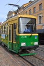 HELSINKI, FINLAND - Jul 20, 2016: Public Transport: Green and yellow tram of Helsinki, Finlan