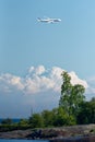 Finnair Airbus A350 XWB airliner flying in extremely low altitude over small island in the Helsinki archipelago