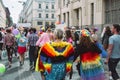 Women in bright clothing and with wings on Helsinki Pride festival on the street