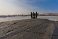 Helsinki Finland 28 March 2021 Spring day at the sea, people rest on the banks of Uunisaari in Helsinki Royalty Free Stock Photo