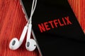 Netflix application icon on Apple iPhone X screen close-up. Netflix app icon. Netflix application. Social media network Royalty Free Stock Photo