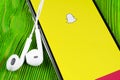 Snapchat application icon on Apple iPhone X smartphone screen close-up. Snapchat app icon. Social media icon. Social network Royalty Free Stock Photo