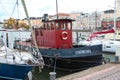 Helsinki, Finland - Oct 29 2015, Vintage small ship with a steam pipe and a red cabin with the bike on the deck, the vessel built