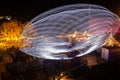 Helsinki, Finland - 19 October 2019: The Carnival of Light event at the Linnanmaki amusement park. Ride Magia in motion, night Royalty Free Stock Photo