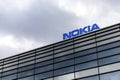 Dark clouds over Nokia logo on top of a building