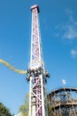 Helsinki, Finland - 14 September 2019: Linnanmaki amusement park, rides tower Raketti in motion and roller coasters Ukko,