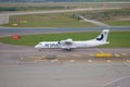 Passenger twin-engine turboprop ATR 72-500 OH-ATK Nordic Regional Airlines on the taxiway of Vantaa Airport Royalty Free Stock Photo