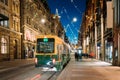 Helsinki, Finland. Tram Departs From Stop On Aleksanterinkatu Street. Night Evening Christmas Xmas New Year Festive