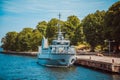 Helsinki, Finland - warship with people on its deck docks at the pier in Suomenlinna on a Sunny summer