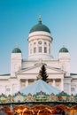 Helsinki, Finland. Xmas Market On Senate Square With Holiday Carousel